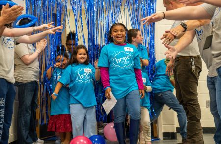 Ashley, Hope to Dream partner on bed donation event